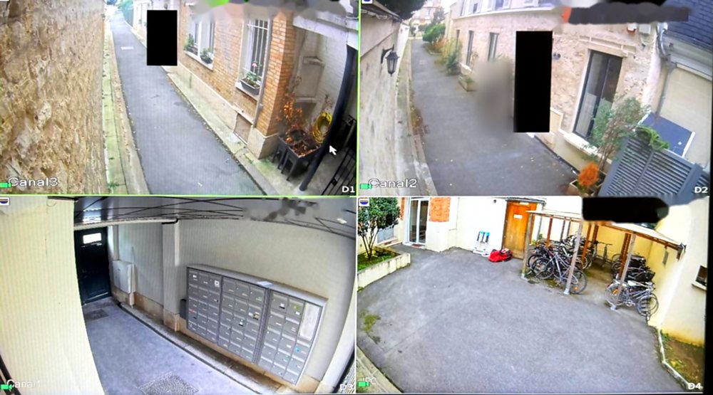 Écran de contrôle : allée, boîtes aux lettres et abri vélos, avec des zones privatives masquées par des rectangles noirs